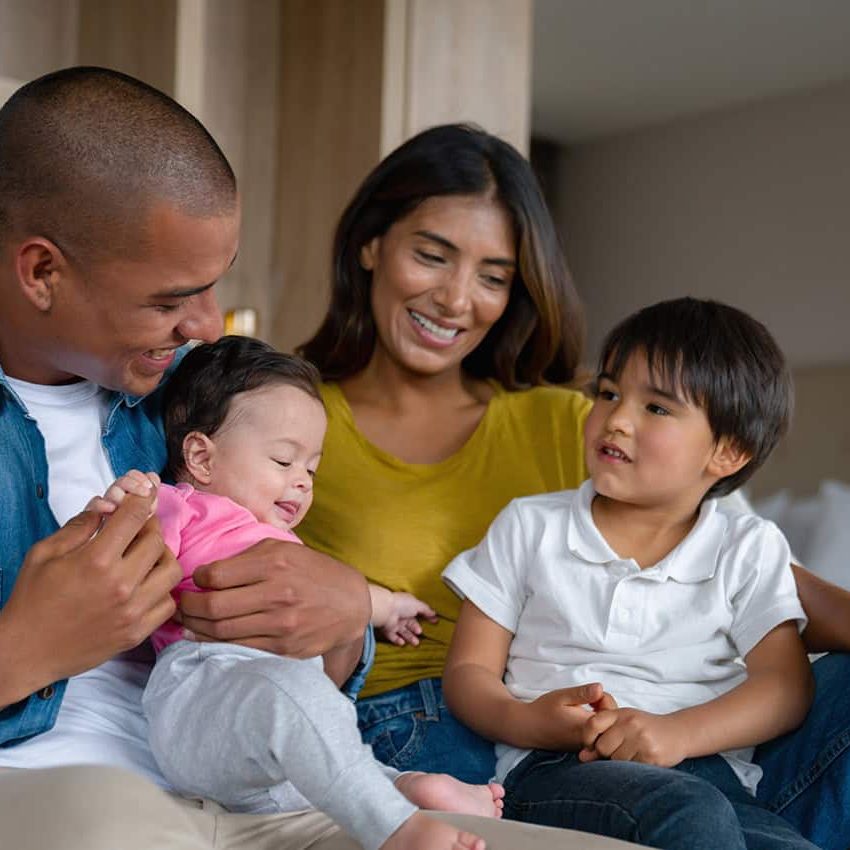 Family of four waiting at doctor's office