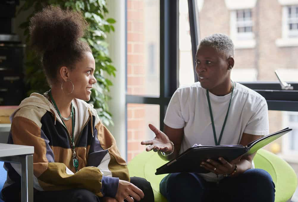 young woman meeting with counselor