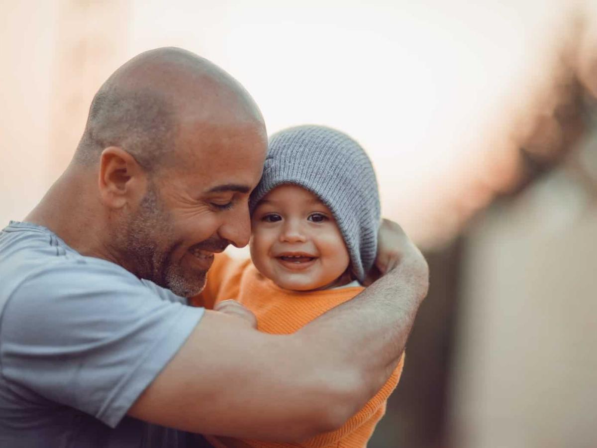 father taking care of baby