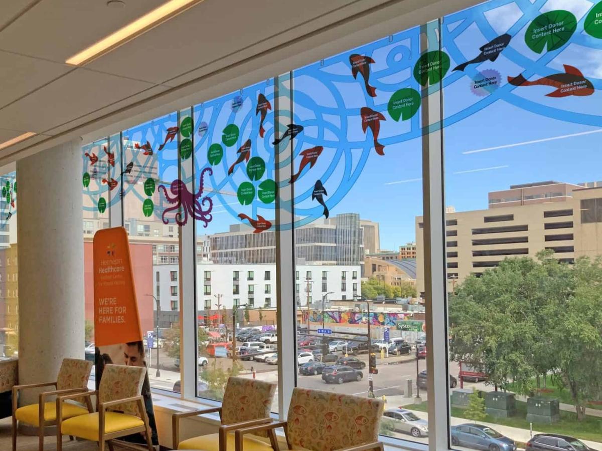 Rendering of the donor wall, showing donor stickers on window