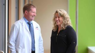 female smiling next to a male Hennepin employee