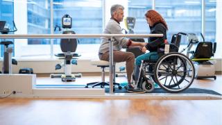 Provider with a patient who is in a wheelchair