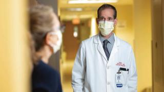 Gavin Bart consults with a colleague