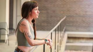 patient standing in courtyard looking toward the future, addiction medicine patient