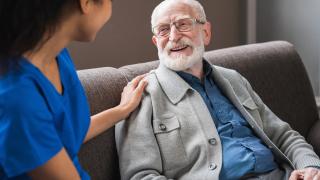 provider with elderly male patient