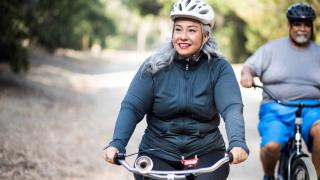 Seniors On Bikes With Helmets