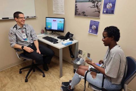 addiction medicine provider with patient in clinic room