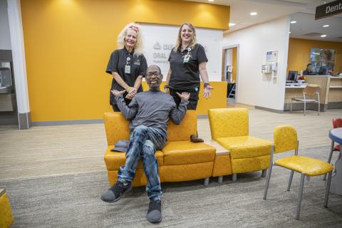 Black adult male with two white females 