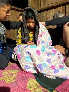 Eh Moo at the refugee camp with the young man who had kidney disease