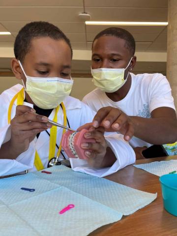 black men with stethoscopes, latine youth with stethoscopes, black men with stethoscopes, medical education youth summits, medical ed for youth, latin youth