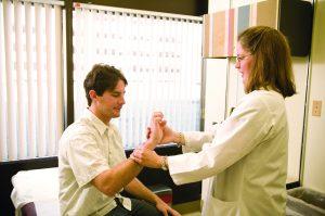 Dr. Sarah Rockswold with a patient 2014