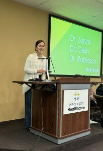 Jane sharing Scott's message at conference