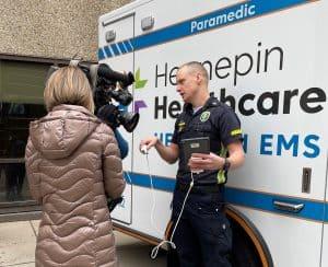 Hennepin EMS paramedic skilled in ultrasound use being interviewed by news station. 