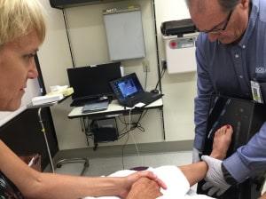 Linda Beaverson has her foot measured for orthotic inserts, Giving foot pain the boot, diagnosis of plantar fasciitis, podiatrist, orthotic inserts, supportive shoes with good arch support
