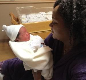 mom with newborn baby, HCMC offering nitrous oxide, pain during labor, analgesic for labor pain, coping with pain during labor, patients coping with pain during labor