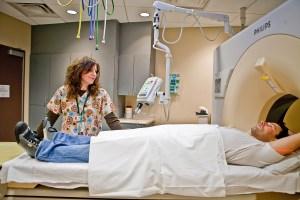 radiology tech next to phillips scan, Avoiding unnecessary radiation, low-dose X-rays, CT scans at HCMC, less radiation, less invasive procedure