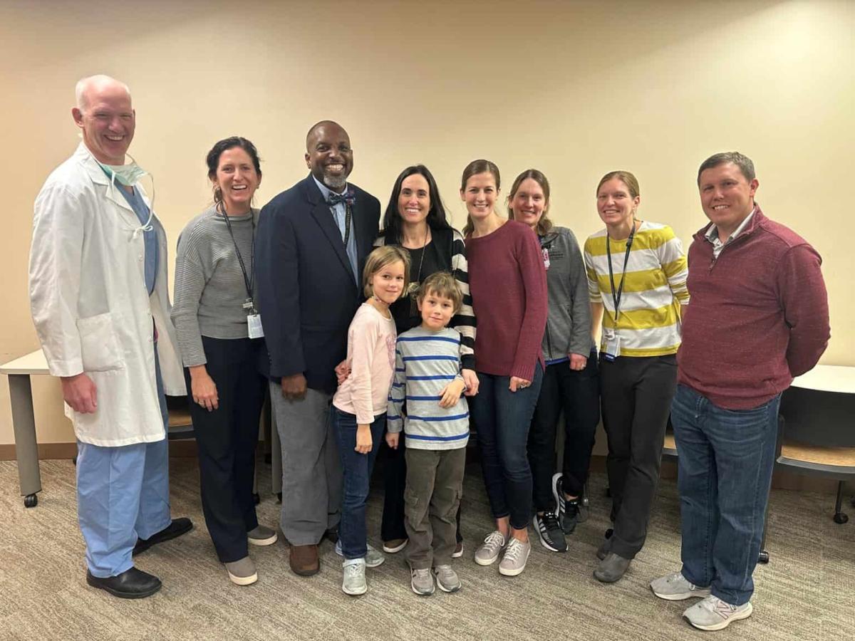 Brain injury patient Erin Carlson with tbi staff, tbi, patient story, therapy, PICU, grateful patient reunion, erin duffy carlson, car accident, head injury, glasgow coma scale