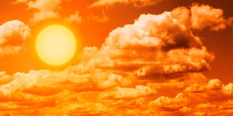 Orange sky with clouds and bright sun showing intense heat, hot, weather, cool, regulate, temperature