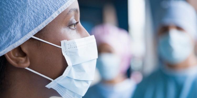 female black doctor with mask and two other white doctors, what it’s like to be black and a doctor in white america, overt racism, diversity in medicine, overcome biases, racial justice work, dr iesha galloway-gilliam