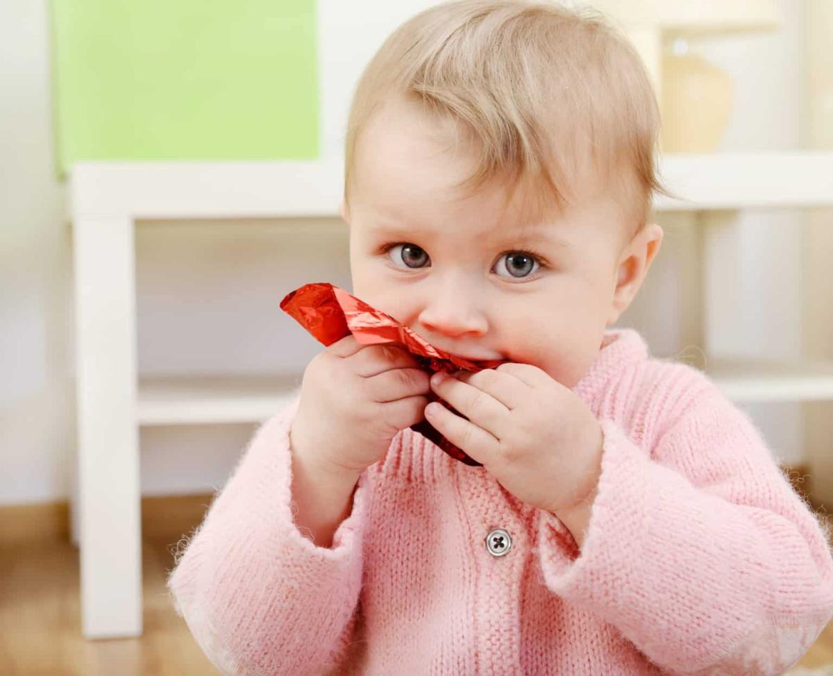 young child putting something in her mouth, don't eat that, problems if they are swallowed, swallowing episode, proper supervision of kids, minnesota poison control system, dr krishnan subrahmanian