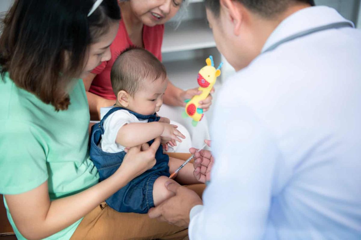 A Little Child And His Family Visit The Doctor For A Routine Health Checkup