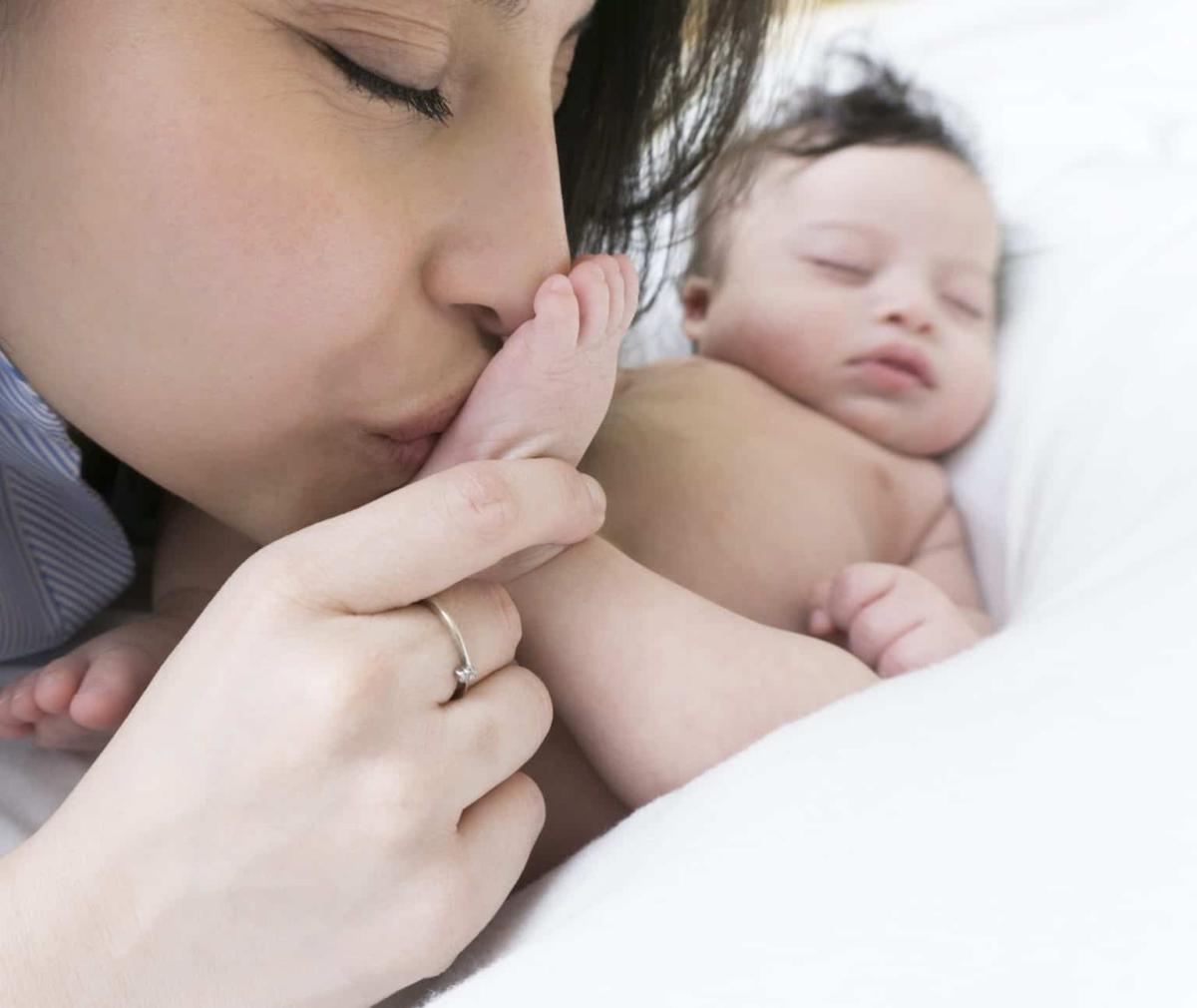 mom with sleeping newborn baby, post partum depression, baby blues, program to help mothers bond with their babies, post partum support