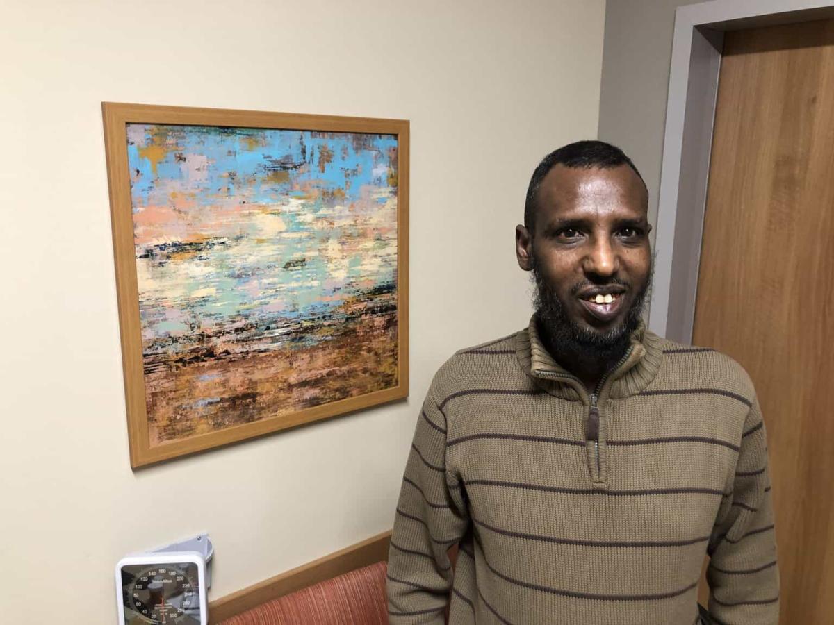 Ahmed Warfa in clinic room, ecmo, improving chances for survival, lungs fail, shallow breathing, chest pain