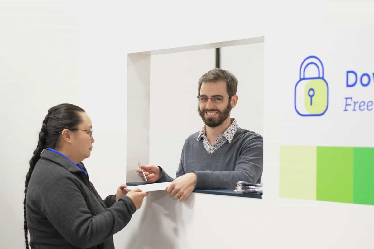 joe helping a staff member, voices of hennepin healthcare, joe kreisman, compassionate healthcare system, homelessness in downtown minneapolis, advance health equity