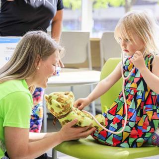 Provider checks a teddy bear