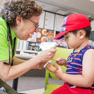 Provider checks a teddy bear