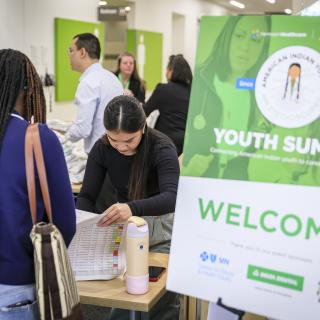 american indian youth summit student signing in at event