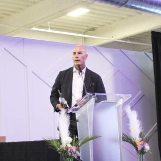 dr wyatt speaking behind the podium, health equity summit