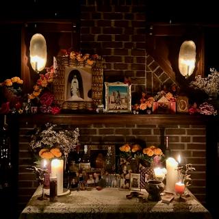 Ofrenda has various photos and paraphernalia to honor and celebrate the dead