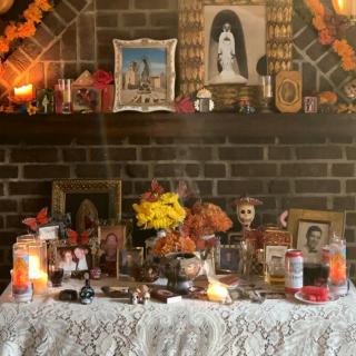 Ofrenda has various photos and paraphernalia to honor and celebrate the dead