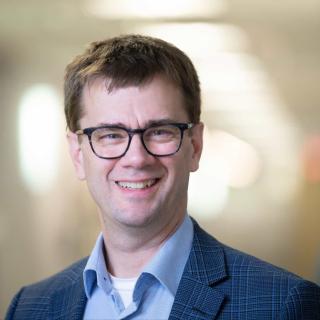 dr david hilden in hospital hallway, Podcast is the new prescription for Healthy Matters, healthcare topics, internal medicine physician, healthcare podcast, interviews with medical experts