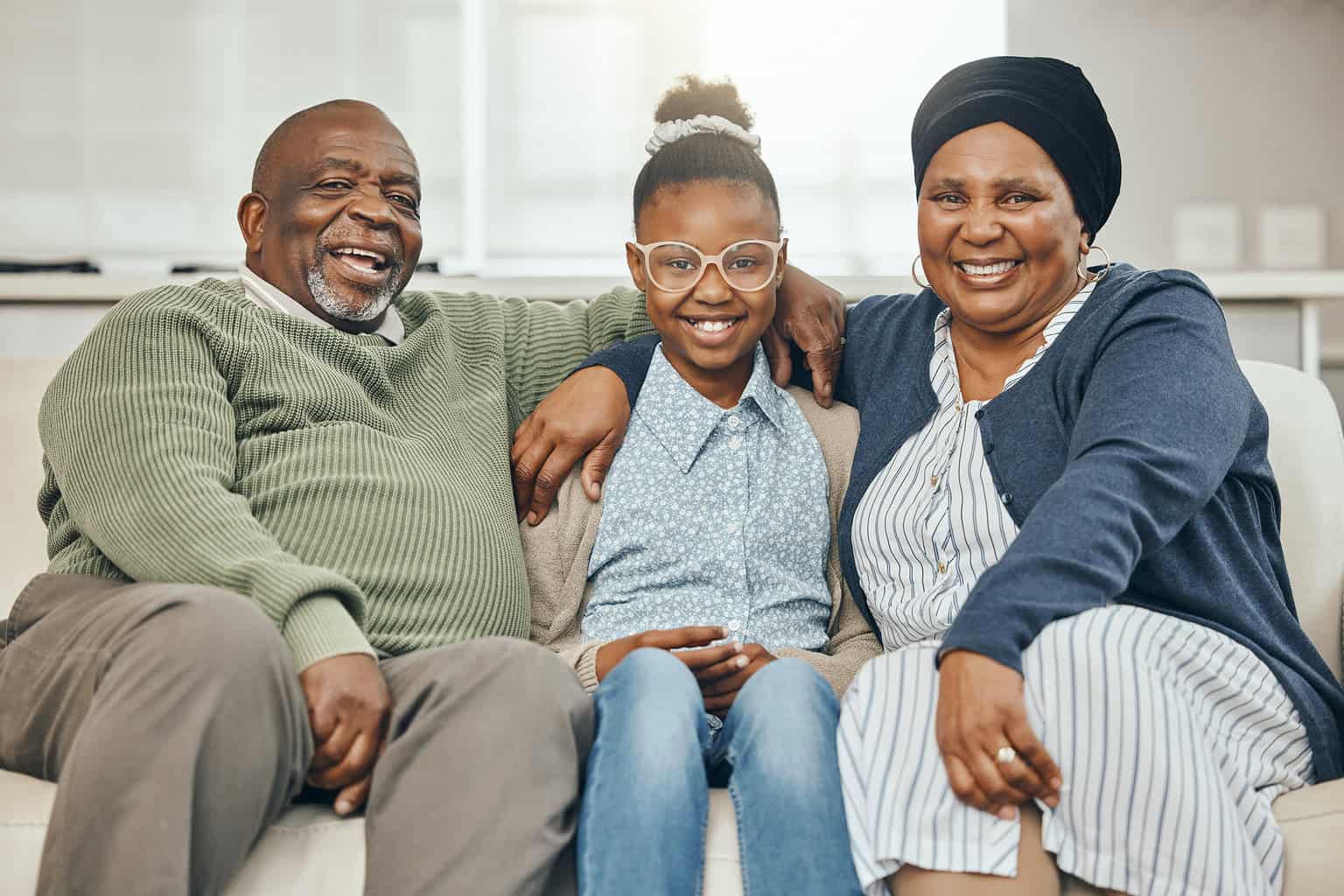 Shot Of Two Grandparents Bonding With Their Grandchild On A Sofa At Home, senior care, hennepin county senior services, what is senior care, senior care phone number