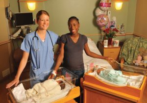 birth center nurse with new mom, 20 Surprising Reason, Have Your Baby at HCMC, give birth at hennepin county medical center, giving birth at HCMC, why you should give birth at hcmc