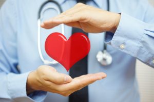 doctor closeup with stethoscope and heart, Did you wake up with high blood pressure on Monday, american college of cardiology, american heart association, blood pressure guidelines, new guidelines for high blood pressure